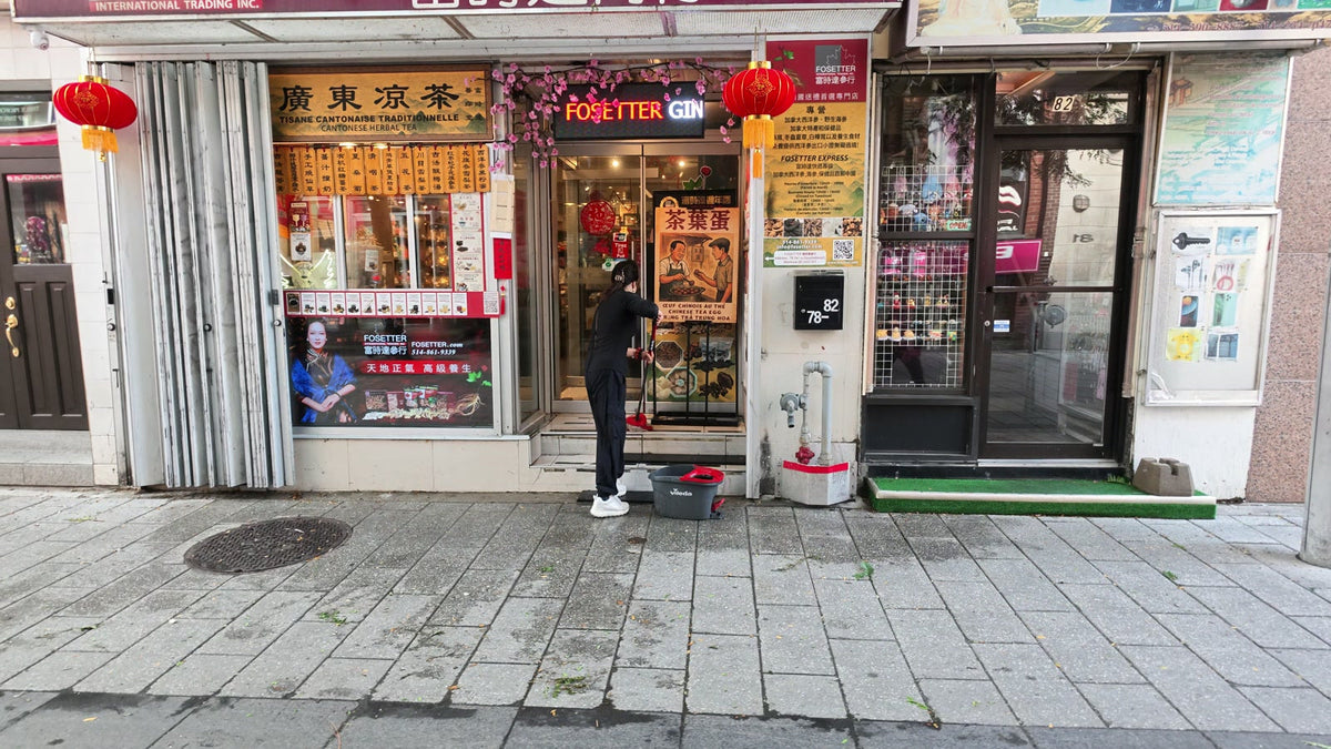 The Fosetter storefront at 78 Rue De La Gauchetière Ouest in the morning, with Carmen cleaning the front door.