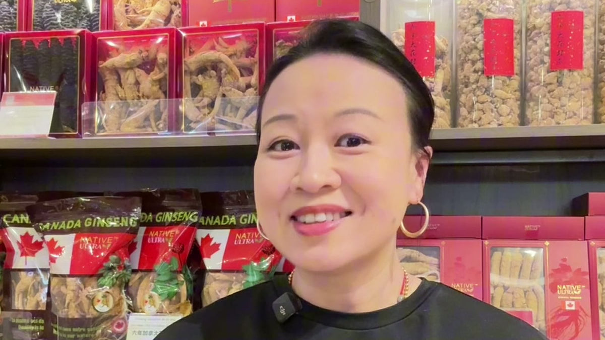 Carmen smiling in front of shelves of NATIVE ULTRA Canadian ginseng.
