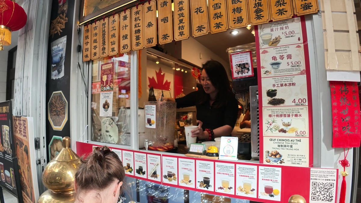 Serving herbal tea at the Fosetter window in Montreal Chinatown